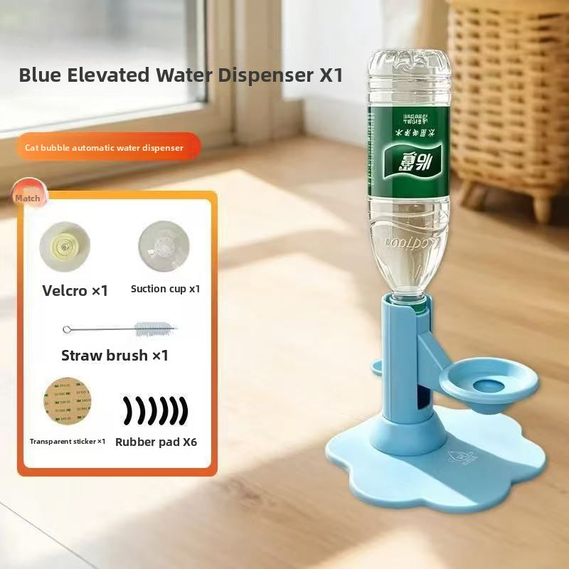 A blue elevated water dispenser made from a clear plastic water bottle with a green label, mounted on a light blue flower-shaped stand on a wooden floor. The image includes a product inset showing included accessories: Velcro, suction cup, straw brush, and transparent sticker/rubber pads.