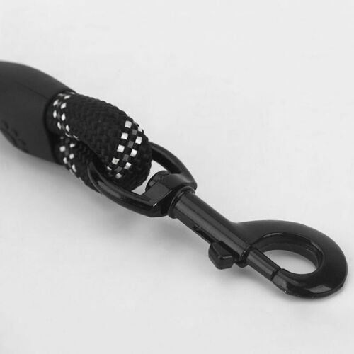 Close-up of a black dog leash with a metal clip on a light gray background