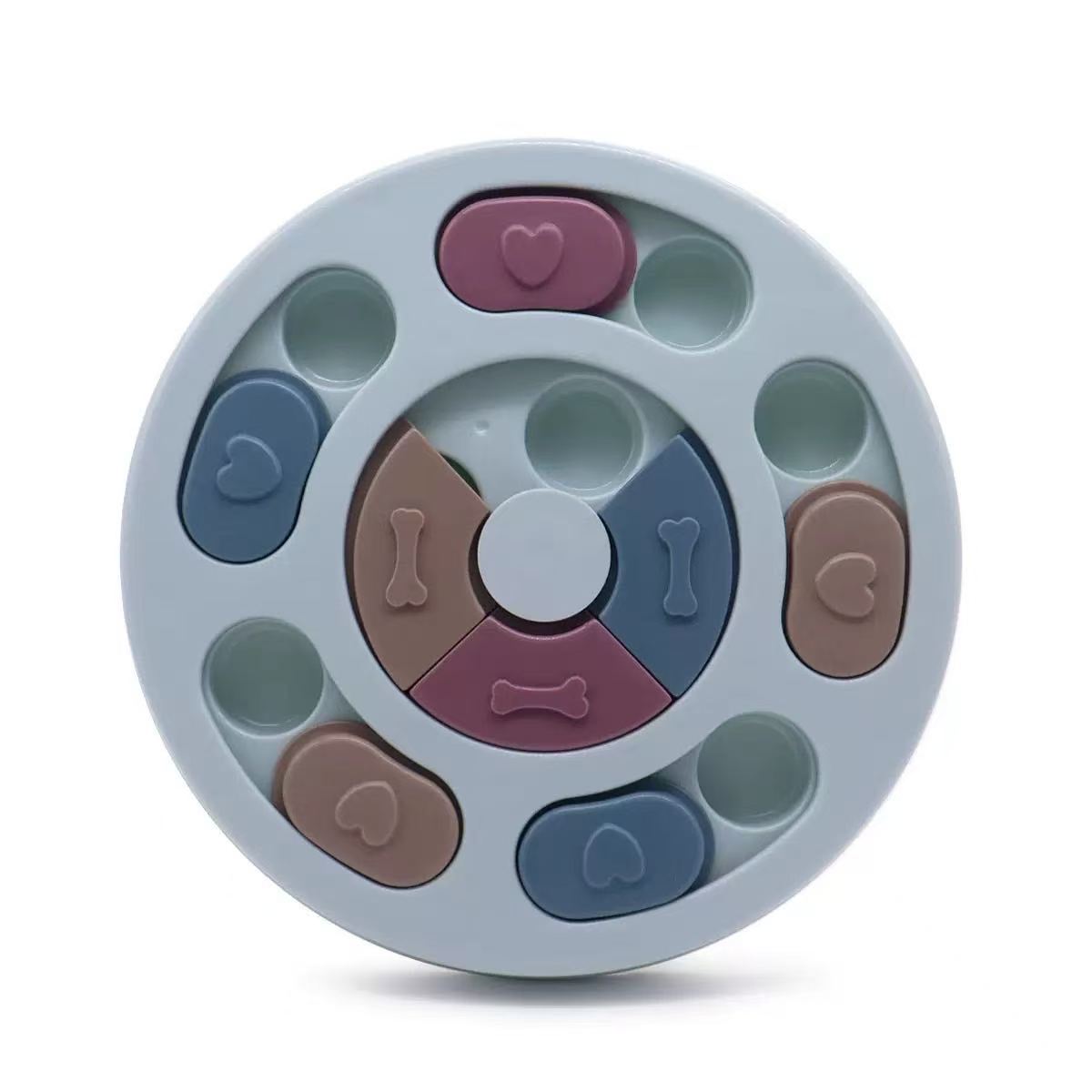 Round pet toy with various shapes and colors on a white background