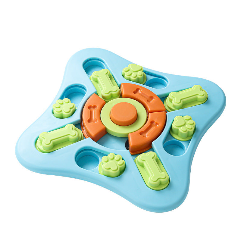 A blue star-shaped plastic toy with green bone and paw-print pieces and an orange circular center, shown on a plain white background.