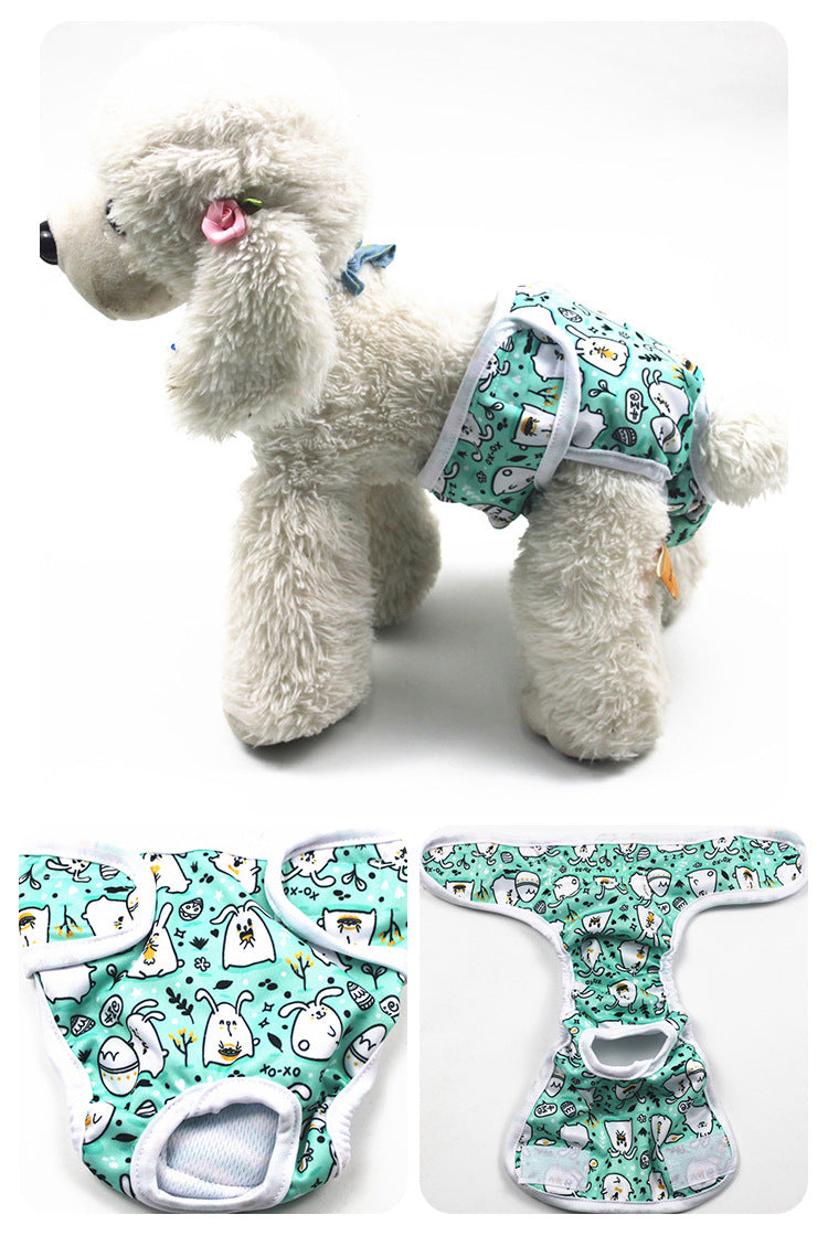 Stuffed dog toy with a patterned harness and two matching doggy diapers on a white background