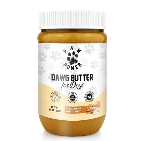 A jar of Paw Power Dawg Butter for Dogs, featuring a white ribbed cap and a white label with black text and paw prints, filled with peanut butter. The jar is set against a plain white background.