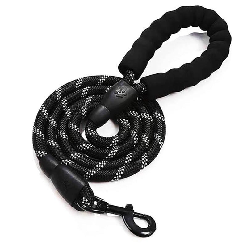 A black dog leash with a thick braided black and white rope, a padded black handle, and a black metal clip, shown on a plain white background.