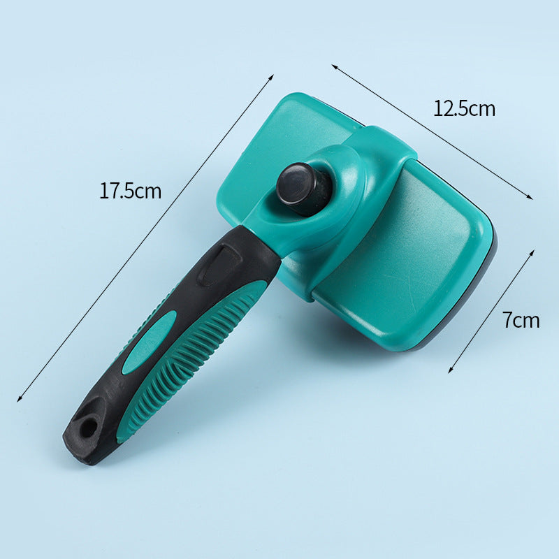 A teal and black pet grooming brush with dimension arrows and labels showing 17.5cm length, 12.