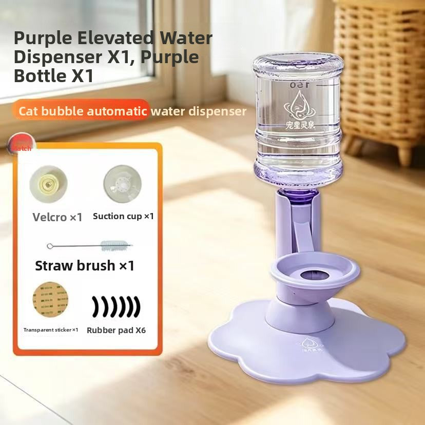 Purple elevated water dispenser with a clear water bottle and purple base, shown on a wooden surface with a product inset card detailing included accessories.