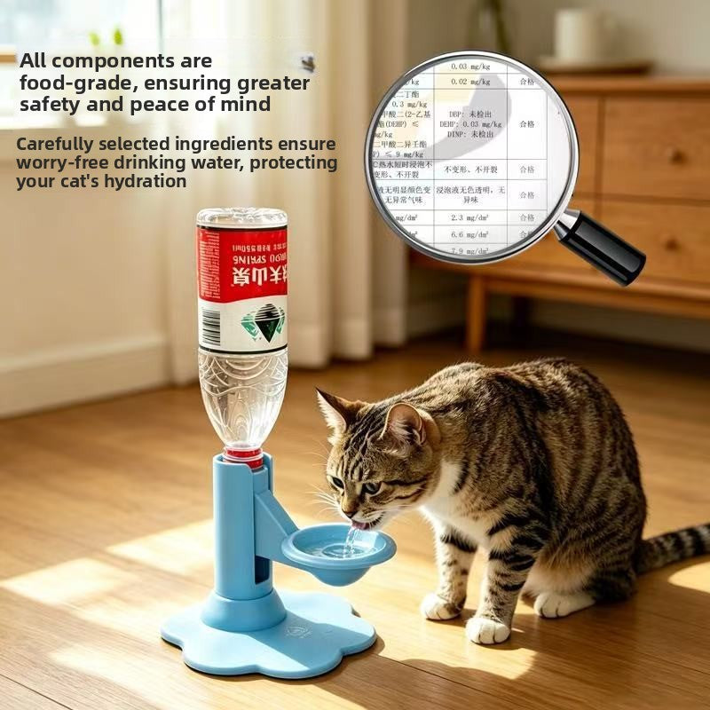 A cat drinking water from a blue pedestal pet water bottle feeder with a clear bottle top, shown on a wooden floor in a home setting. A magnifying glass graphic highlights the bottle label ingredients, with text in English and Chinese describing food-grade materials.