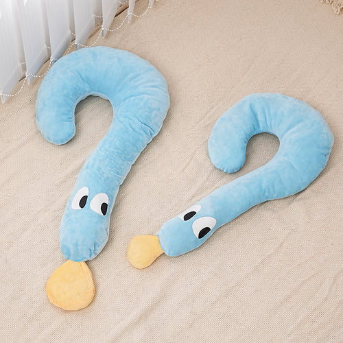 Two blue snake-shaped pillows with eyes and a yellow nose on a beige surface.